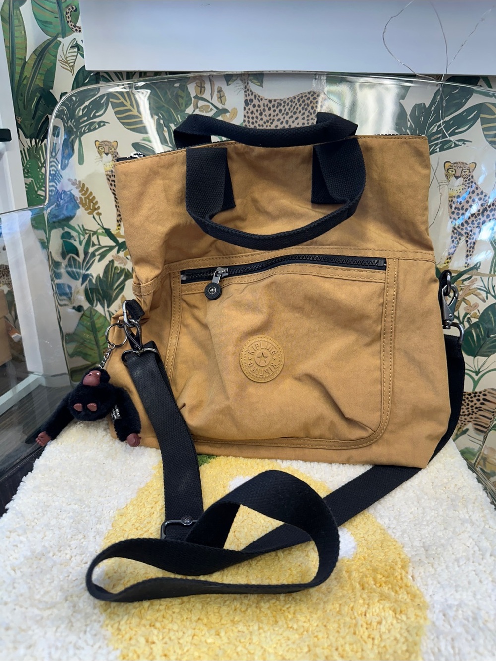 Kipling Tan Canvas Crossbody Tote with Black Strap